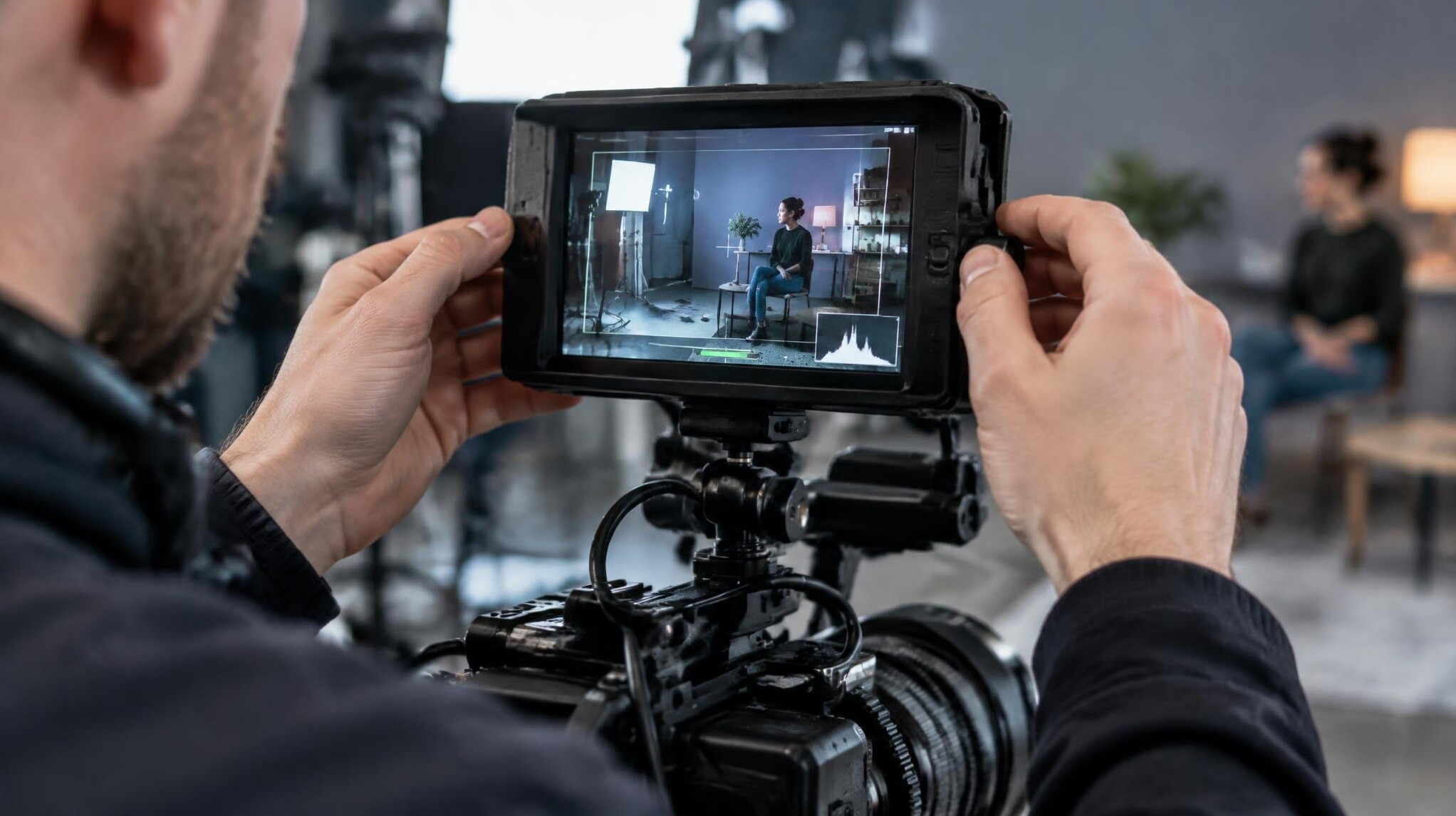 Camera operator checking a shot on a monitor
